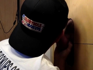 Gloryhole lover eagerly milking dicks through the wall