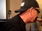 Inked mature DILF blowing gloryhole BBC